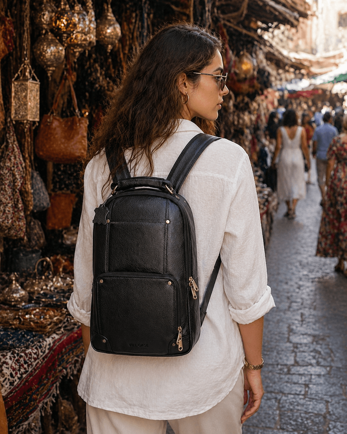 The Bavaria Black NDM Leather backpack by VILL OKSE with female model