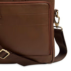 brand-cognac-nappa-leather-laptop-bag-closeup-strap-attachment-detail - VILL OKSE